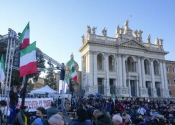 Carrots, sermons, sticks: Vaccine mandates face opposition around the globe