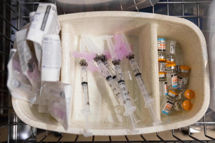 A tray holding syringes and vials
