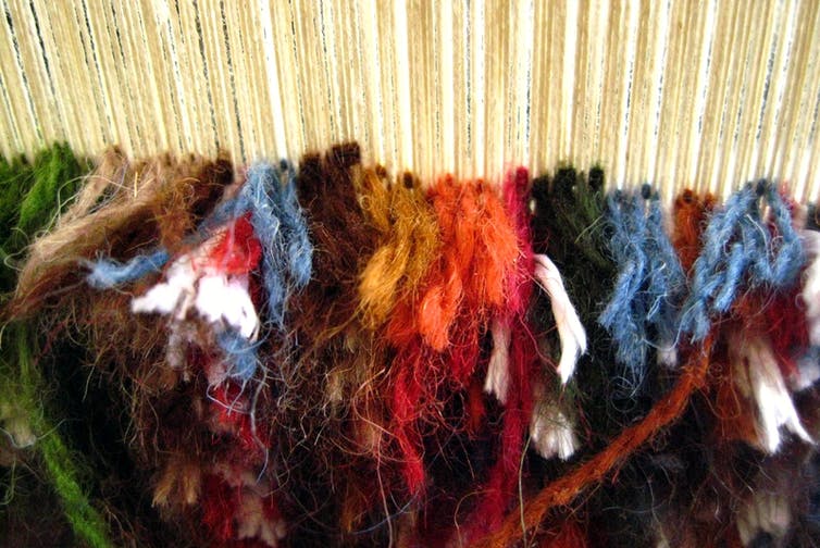 Close-up of a carpet in progress on a loom
