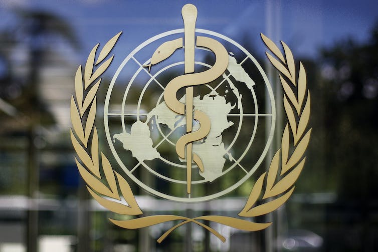 The logo of the World Health Organization: a caduceus superimposed on a globe surrounded by a wreath