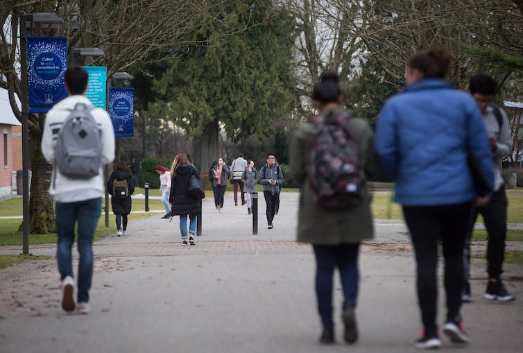 Students seen walking on a campus.