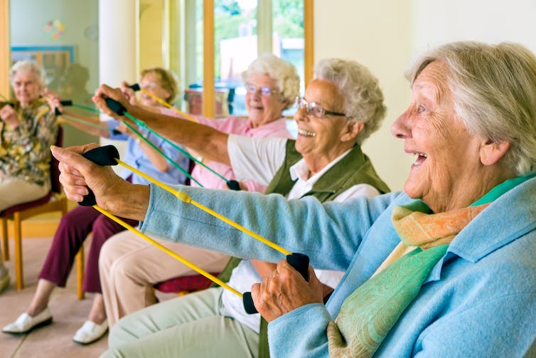 People in a care home doing exercise.