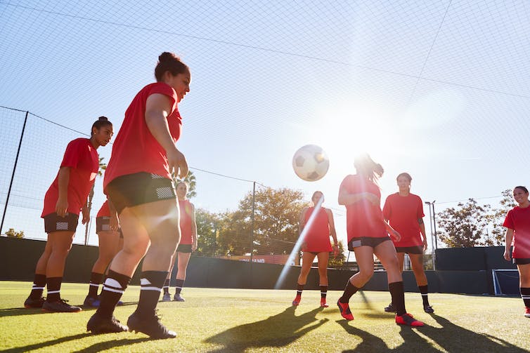 womens soccer team training outdoors