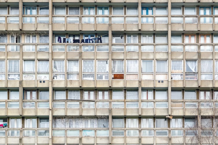 The side of a block of council flats in disrepair in London