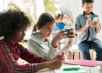 Social media warning labels and school cell phone bans: Do they unlock better youth mental health?