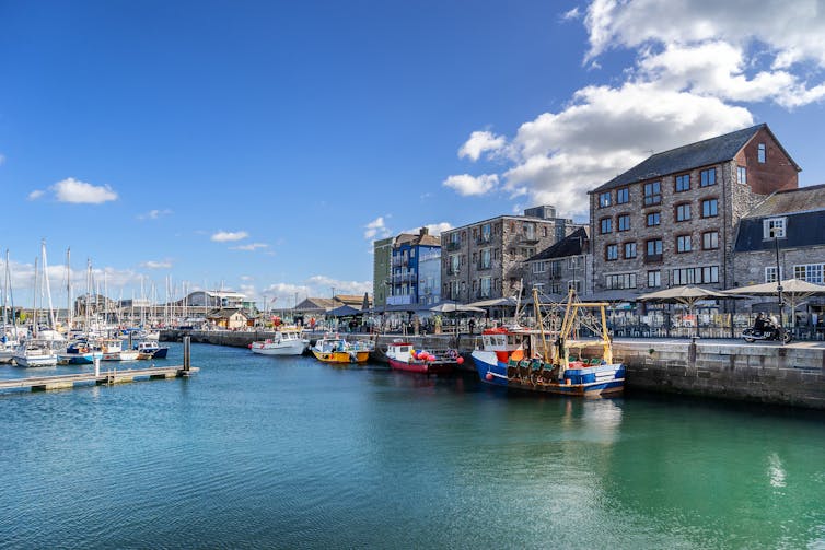 pretty harbour with colourful fishing boats moored by the Barbican area of plymouth