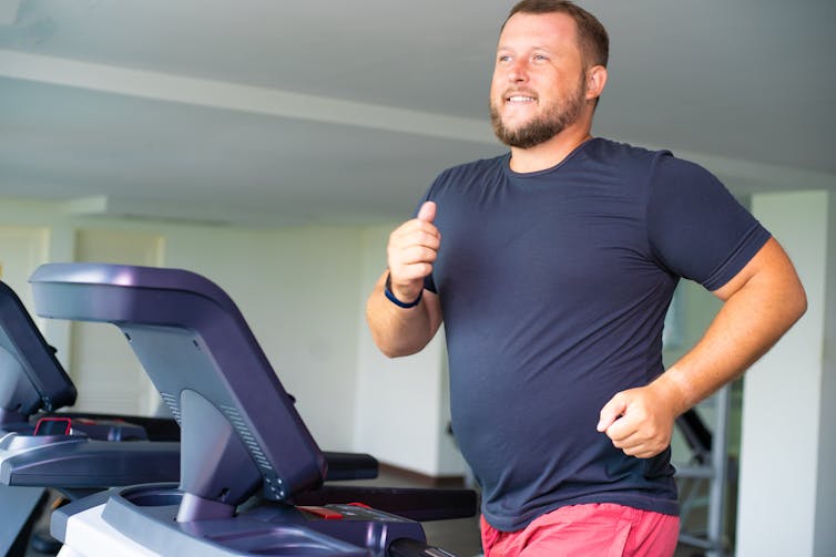 A man runs on a treadmill.