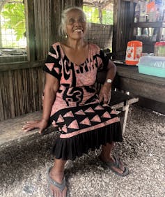 Woman smiling in her kitchen in Kiritimati