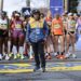 Marathon runners rely on family and experts to succeed, while races rely on passionate volunteers
