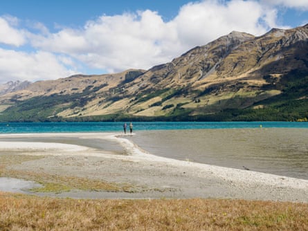 Walkers on a beach in Glenorchy