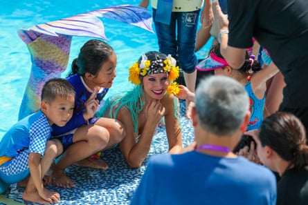 Professional mermaid Mermaid Kat performing at a birthday party.
