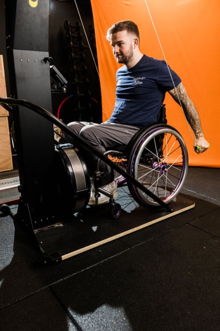 Gough sitting in his wheelchair doing an upper-body workout