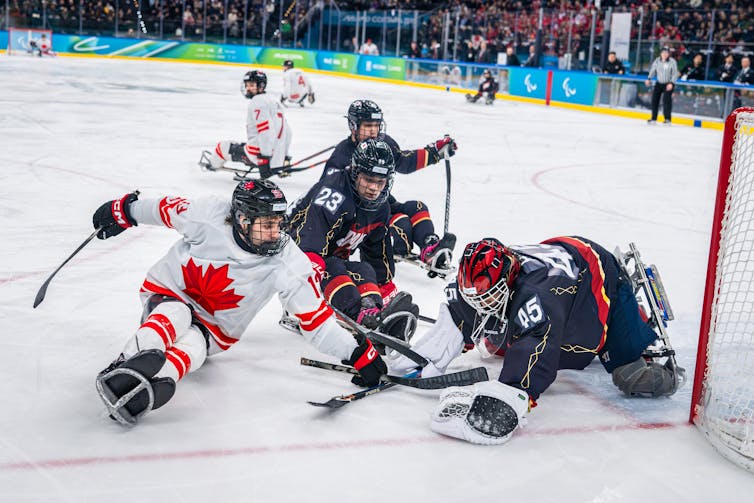 Para ice hockey players compete on the ice.