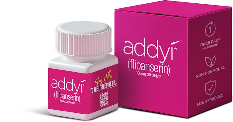 A pill bottle next to its box.