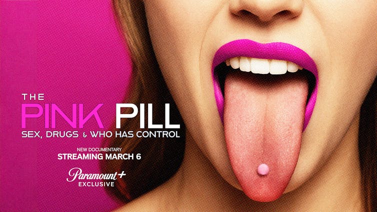 A trailer banner for a movie with a woman sticking her tongue out with a pill on it.