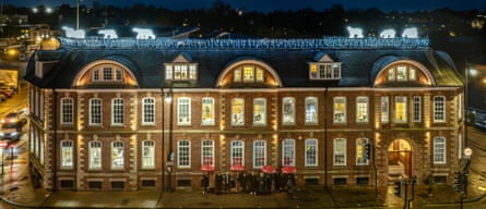 Large toy polar bears on the top of a company’s headquarters at Christmas.