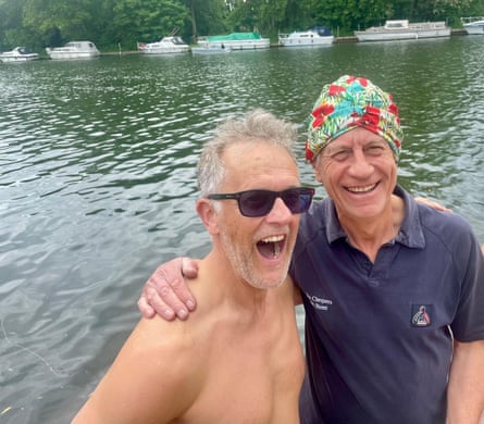 Mark Rice-Oxley and Marcus Grimond smile as they stand by the Thames