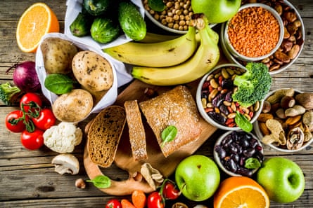 A colourful selection high-fibre foods on a wooden background.