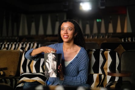 A woman watches a film in an Everyman cinema.