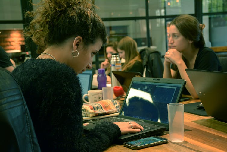 People at a table in a shared workspace