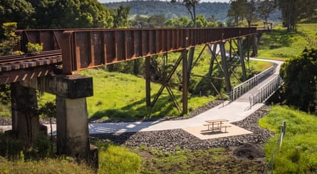 Cycling path next to an old disused railway line with a bridge