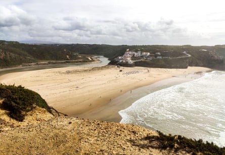 A sandy cove on the Fisherman’s Trail in Portugal, seen from high on a cliff path.
