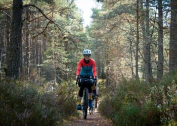 ‘It’s hard to imagine the fires of July’: a bike ride through the Cairngorms in Scotland