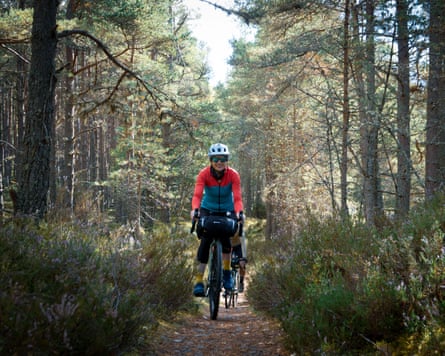 ‘It’s hard to imagine the fires of July’: a bike ride through the Cairngorms in Scotland